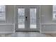 Interior doors open to screened-in porch area; shows view to wooded area outside at 6141 Flamingo Dr, Nineveh, IN 46164