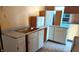 Kitchen awaiting renovation with existing cabinets and countertops at 621 N Euclid Ave, Indianapolis, IN 46201