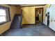 Sunlit living room with staircase, awaiting transformation with new finishes at 621 N Euclid Ave, Indianapolis, IN 46201