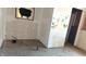 Room under construction with unfinished walls, hardwood floors, and exposed plumbing at 621 N Euclid Ave, Indianapolis, IN 46201