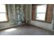 Bare bedroom with exposed drywall and hardwood floors at 621 N Euclid Ave, Indianapolis, IN 46201