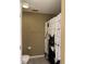 Neutral bathroom features a toilet and shower with stylish cat shower curtain at 6318 Amarillo Way, Indianapolis, IN 46237