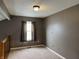 Neutral bedroom with a window providing natural light and carpeted flooring at 6318 Amarillo Way, Indianapolis, IN 46237