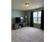 Comfortable bedroom with window and soft carpet, perfect for relaxation at 6318 Amarillo Way, Indianapolis, IN 46237