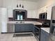 Modern kitchen with stainless steel appliances and stylish two-tone cabinetry at 6318 Amarillo Way, Indianapolis, IN 46237