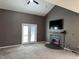 Cozy living room featuring fireplace and access to outdoor space at 6318 Amarillo Way, Indianapolis, IN 46237