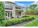 The home offers a serene outdoor space with a patio, lush hedges, and beautiful lawn at 6430 Meridian Pkwy # Apt A, Indianapolis, IN 46220