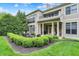 Beautiful backyard with seating area, manicured hedges, and exterior views of the home at 6430 Meridian Pkwy # Apt A, Indianapolis, IN 46220