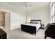 Bright bedroom with a double bed, light-filled windows and ensuite bathroom at 6430 Meridian Pkwy # Apt A, Indianapolis, IN 46220