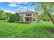 Expansive green lawn complements this home's exterior with dual balconies and brick accents at 6430 Meridian Pkwy # Apt A, Indianapolis, IN 46220