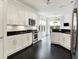 Contemporary kitchen with white cabinetry, dark countertops, and stainless steel appliances at 6430 Meridian Pkwy # Apt A, Indianapolis, IN 46220