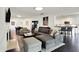 Spacious living area with fireplace, modern furnishings, and open access to the kitchen and dining room at 6430 Meridian Pkwy # Apt A, Indianapolis, IN 46220