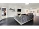 Open living room with comfortable seating, fireplace, and herringbone flooring, offering a cozy atmosphere at 6430 Meridian Pkwy # Apt A, Indianapolis, IN 46220