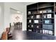 Stylish living room with built-in bookshelves and view to dining room at 6430 Meridian Pkwy # Apt A, Indianapolis, IN 46220