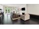 Elegant living room with modern furniture, fireplace, and access to the outdoor space at 6430 Meridian Pkwy # Apt A, Indianapolis, IN 46220