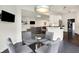 Breakfast nook open to a kitchen and living space in a modern home at 6430 Meridian Pkwy # Apt A, Indianapolis, IN 46220