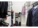 Organized walk-in closet with custom shelving and racks for shoes and clothing at 6430 Meridian Pkwy # Apt A, Indianapolis, IN 46220