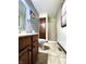 Bathroom featuring a shower, toilet, sink, and neutral colors at 6723 Balmoral Rd, Indianapolis, IN 46241