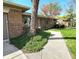 Charming brick home featuring a walkway, trees, and a well-maintained lawn at 6723 Balmoral Rd, Indianapolis, IN 46241