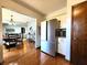 Bright kitchen featuring stainless steel refrigerator and hardwood flooring at 6723 Balmoral Rd, Indianapolis, IN 46241