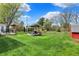 Expansive green backyard with a patio and sheds at 6826 Hague Rd, Indianapolis, IN 46256