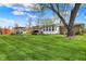 Sprawling backyard featuring outdoor seating, a shed, and lush lawn at 6826 Hague Rd, Indianapolis, IN 46256