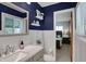 Modern bathroom features white subway tiles, a vanity with stylish fixtures, and access to the main bedroom at 6826 Hague Rd, Indianapolis, IN 46256