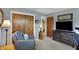 Inviting bedroom with a comfortable armchair, closet, and a well-lit space for unwinding at 6826 Hague Rd, Indianapolis, IN 46256