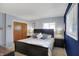Charming bedroom with a wooden bed, neutral-toned walls, and an inviting atmosphere for relaxation at 6826 Hague Rd, Indianapolis, IN 46256