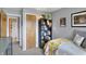 Comfortable bedroom featuring a cozy bed, bookshelf, and convenient access to the hallway and closet at 6826 Hague Rd, Indianapolis, IN 46256