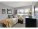 Bright bedroom with a large window, cozy bed, and stylish decor, creating a comfortable retreat at 6826 Hague Rd, Indianapolis, IN 46256