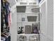 Organized closet featuring shelves with baskets and rods for hanging clothes, maximizing storage space at 6826 Hague Rd, Indianapolis, IN 46256