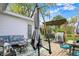 Outdoor deck with a table, chairs, grill, seating, and backyard views, perfect for outdoor entertaining at 6826 Hague Rd, Indianapolis, IN 46256