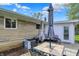 Outdoor deck with a table, chairs, and seating, perfect for dining and relaxation, and has a partial view of the backyard at 6826 Hague Rd, Indianapolis, IN 46256