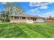 Charming single-story home with stone facade, attached garage, and beautifully maintained lawn at 6826 Hague Rd, Indianapolis, IN 46256