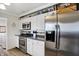 Modern kitchen with white cabinetry, stainless steel appliances, and sleek countertops, perfect for cooking at 6826 Hague Rd, Indianapolis, IN 46256