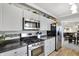Kitchen with stainless steel appliances, spacious countertops, and eat-in dining area at 6826 Hague Rd, Indianapolis, IN 46256