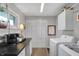 Functional laundry room with washer, dryer, built-in cabinets, and spacious countertop at 6826 Hague Rd, Indianapolis, IN 46256