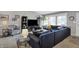 Spacious living room with a large sectional sofa and ample natural light at 6826 Hague Rd, Indianapolis, IN 46256