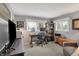 Cozy home office with a wooden desk, carpeted floor, and lots of natural light from the window at 6826 Hague Rd, Indianapolis, IN 46256