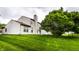 Spacious backyard with a tree on a grassy lawn at 7131 Topp Creek Ct, Indianapolis, IN 46214