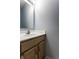 Bathroom vanity with a sink and wooden cabinets with modern hardware at 7131 Topp Creek Ct, Indianapolis, IN 46214