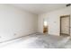 A simple bedroom with access to an ensuite bathroom is ready for renovation and personalization at 7131 Topp Creek Ct, Indianapolis, IN 46214