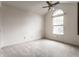 Well-lit bedroom with vaulted ceiling and large arched window offers a tranquil space at 7131 Topp Creek Ct, Indianapolis, IN 46214