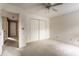 Carpeted bedroom with large closet, ceiling fan, and ample space, perfect for personalization at 7131 Topp Creek Ct, Indianapolis, IN 46214