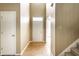 Bright foyer with hardwood floors, white door, and stairway to the side at 7131 Topp Creek Ct, Indianapolis, IN 46214