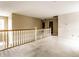 Hallway with wooden railing offering an airy and open space with carpet flooring at 7131 Topp Creek Ct, Indianapolis, IN 46214