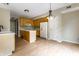 Well-lit kitchen with wood cabinets, white appliances, and central island for food preparation at 7131 Topp Creek Ct, Indianapolis, IN 46214