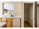Kitchen area with white counters, wood cabinets, dishwasher, and storage, next to hall closet at 7131 Topp Creek Ct, Indianapolis, IN 46214