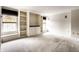 Spacious living room features large windows and custom built-in shelves and storage at 7131 Topp Creek Ct, Indianapolis, IN 46214